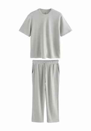 Hellgraues Kurzarm-T-Shirt mit Rundhalsausschnitt, kombiniert mit passenden Sweatpants mit elastischem Bund, seitlichen Taschen und lockerer Passform.