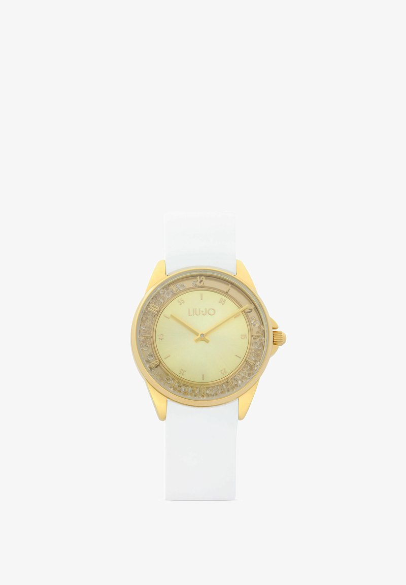 Montre-bracelet Liu Jo ton or avec détails en cristal clair autour du cadran et bracelet en silicone blanc, affichant l'heure à 10h12.