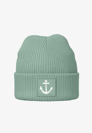 Mint green knitted beanie made of ribbed fabric, featuring a prominent white anchor logo on a square patch at the cuff.