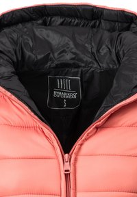 Pink puffer jacket with a zip closure, featuring a black inner lining and stitched panels for insulation. Label reads "BASIC, BYMARIKOO, S."