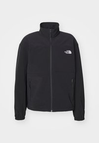 Chaqueta negra con cremallera hecha de tela suave, con cuello alto, puños elásticos y dos bolsillos laterales con cremallera. Cuenta con un pequeño logo en el pecho.