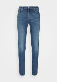 Jeans i denim med medelton, med en åtsittande design, fem fickor och metallknäppning, samt en mjuk yta och raka ben.