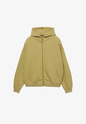 Mikina s kapucí v olivově zelené barvě, s předním zipem, velkými bočními kapsami, žebrovanými manžetami a volným střihem. Měkký bavlněný materiál.