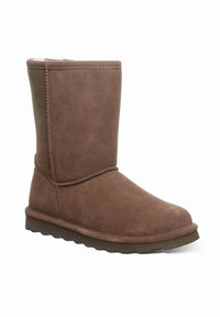 Braune Wildleder-Ankle-Boots mit runder Zehenpartie, flacher Sohle und gesteppten Akzenten. Innenfutter für Wärme und Komfort.