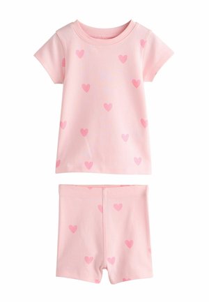 Ružová sada s krátkym rukávom a šortkami s roztrúsenými tmavšie ružovými srdiečkami na mäkkom detskom tkanive.