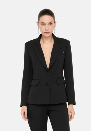 Black blazer with a deep V-neck, single-button closure, and two front pockets. Smooth texture and tailored fit. Small logo detail on lapel.