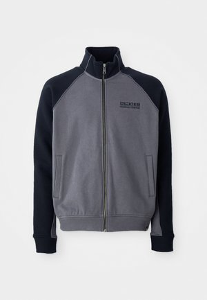 Grey and black zip-up jacket with high collar, two front pockets, and "Dickies Workwear Company" logo on the chest.