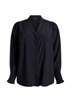 Blusa negra con escote en V, detalles plisados en los hombros y puños fruncidos. Fabricada con una tela ligera de textura suave.