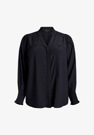 Blouse noire avec un décolleté en V, des détails plissés aux épaules et des poignets smockés. Fabriquée à partir d'un tissu léger avec une texture lisse.