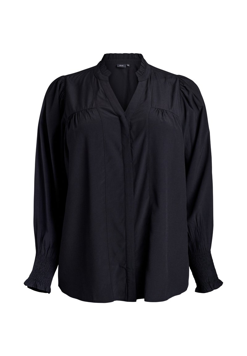 Blusa nera con scollatura a V, dettagli plissettati sulle spalle e polsini arricciati. Realizzata in tessuto leggero con una texture morbida.