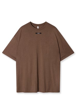 T-shirt in cotone marrone con vestibilità rilassata, scollo rotondo e maniche corte. Presenta una piccola etichetta nera con "10 DAYS" sul davanti.
