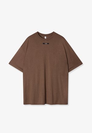 Braunes Baumwoll-T-Shirt mit lockerer Passform, rundem Halsausschnitt und kurzen Ärmeln. Features ein kleines schwarzes Etikett mit "10 DAYS" auf der Vorderseite.