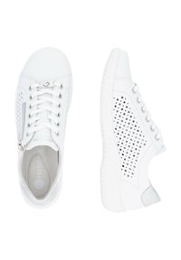 White sneakers with a perforated design, smooth texture, laces, and a side zipper. The sole is textured and slightly raised.