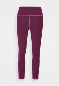 Lila högmidjade leggings med kontrasterande rosa sömmar och sidotextdetalj, figurnära design och mjukt, elastiskt tyg.