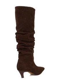 Brown suede knee-high boot with a slouchy design, tapered toe, and a medium stacked heel. Smooth texture with minimal visible seams.