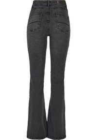 Uppfällda svarta jeans gjorda av denim; har dubbla bakfickor och hög midja. Slät textur med en lätt stretch, enfärgad utan mönster.
