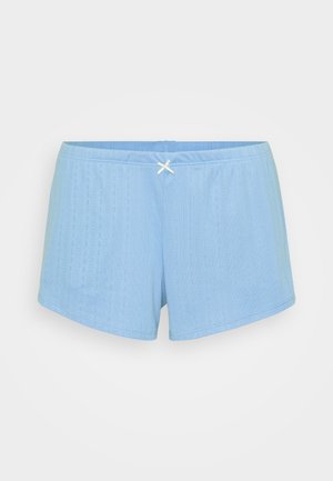 Lys blå shorts laget av strukturert stoff, med et rillemønster, elastisk midjebånd og en liten hvit sløyfe akse på baksiden.