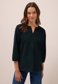 Blusa verde scuro a maniche lunghe con scollo a V, vestibilità comoda e maniche arricciate, realizzata in un tessuto morbido con una superficie liscia.