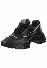 Black athletic sneaker with a textured leather upper, silver accents, and thick rubber sole. Features decorative laces and reflective heel tab.
