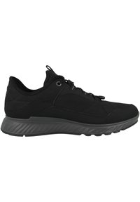 Scarpe sportive nere con una tomaia in rete testurizzata, design minimalista e una suola grigia ammortizzata. Include lacci per una vestibilità sicura.