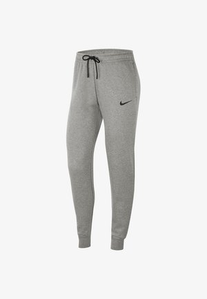 Pantalon de survêtement gris Nike avec taille élastique, cordon noir, poches latérales, chevilles côtelées et logo Nike swoosh noir sur la cuisse gauche.