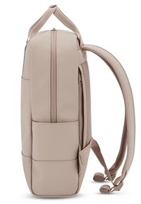 Beige backpack with a smooth, matte finish, featuring a zippered main compartment, padded straps, and two side pockets for storage.