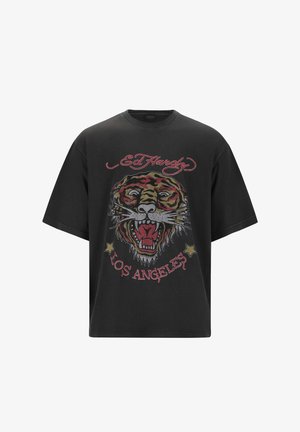 Black oversized t-shirt featuring a multicolored tiger graphic with intricate details, embroidered text, and stars, made from cotton fabric.