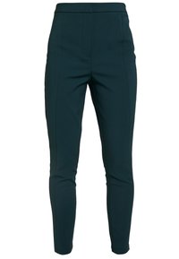 Mörkgröna slim-fit byxor i ankle-längd med hög midja och utan synliga knappar eller fickor.