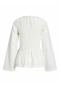 Hvit langermet bluse med smokkedetaljert ryggpanel, innsnevret midje og nøkkelhullets lukking ved halsen.