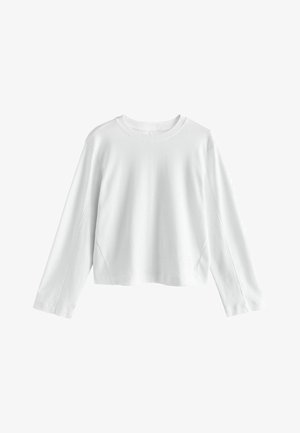 Witte lang-sleeve cropped top, gemaakt van soepel katoen. Heeft een ronde halslijn en ingestikte mouwen met minimale stikdetails.