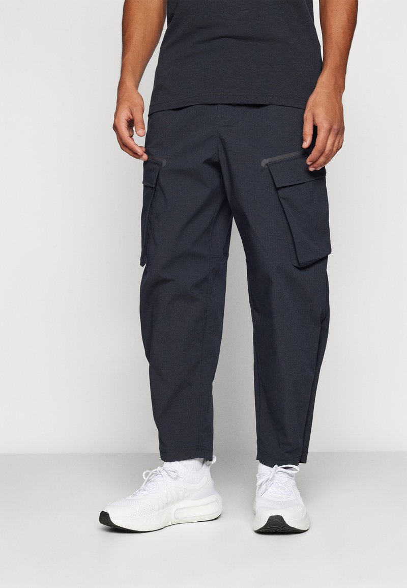 Under Armour UNSTOPPABLE - Hlače za otvoreno - black
