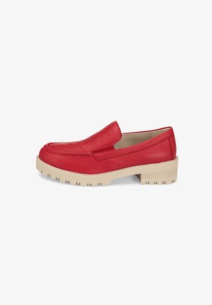 Red leather slip-on shoe with a textured upper, rounded toe, and thick beige rubber sole featuring a tread pattern.