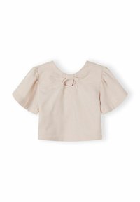 Blouse rose clair à manches courtes avec manches bouffantes et petite découpe en forme de goutte sous le col sur fond blanc.