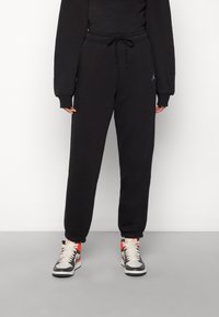 Jordan - W J FLIGHT FLC PANT CORE - Treniņtērpa apakšdaļas - black Miniatūras attēls 1