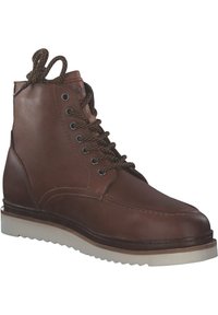 Braune Leder-Stiefelette mit schwarzen und braunen gemusterten Schnürsenkeln, runder Zehenpartie, gepolstertem Schaft und weißer Gummisohle mit genoppter Profilierung.