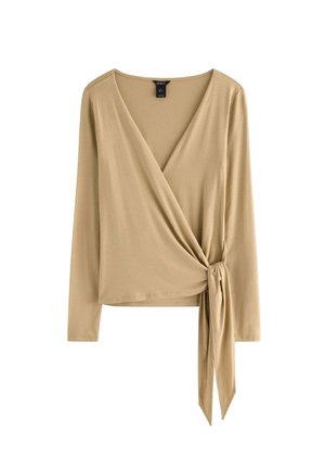 Top beige a maniche lunghe con scollo a V e dettaglio annodato in vita. Realizzato in tessuto liscio ed elastico. Design semplice e pulito.