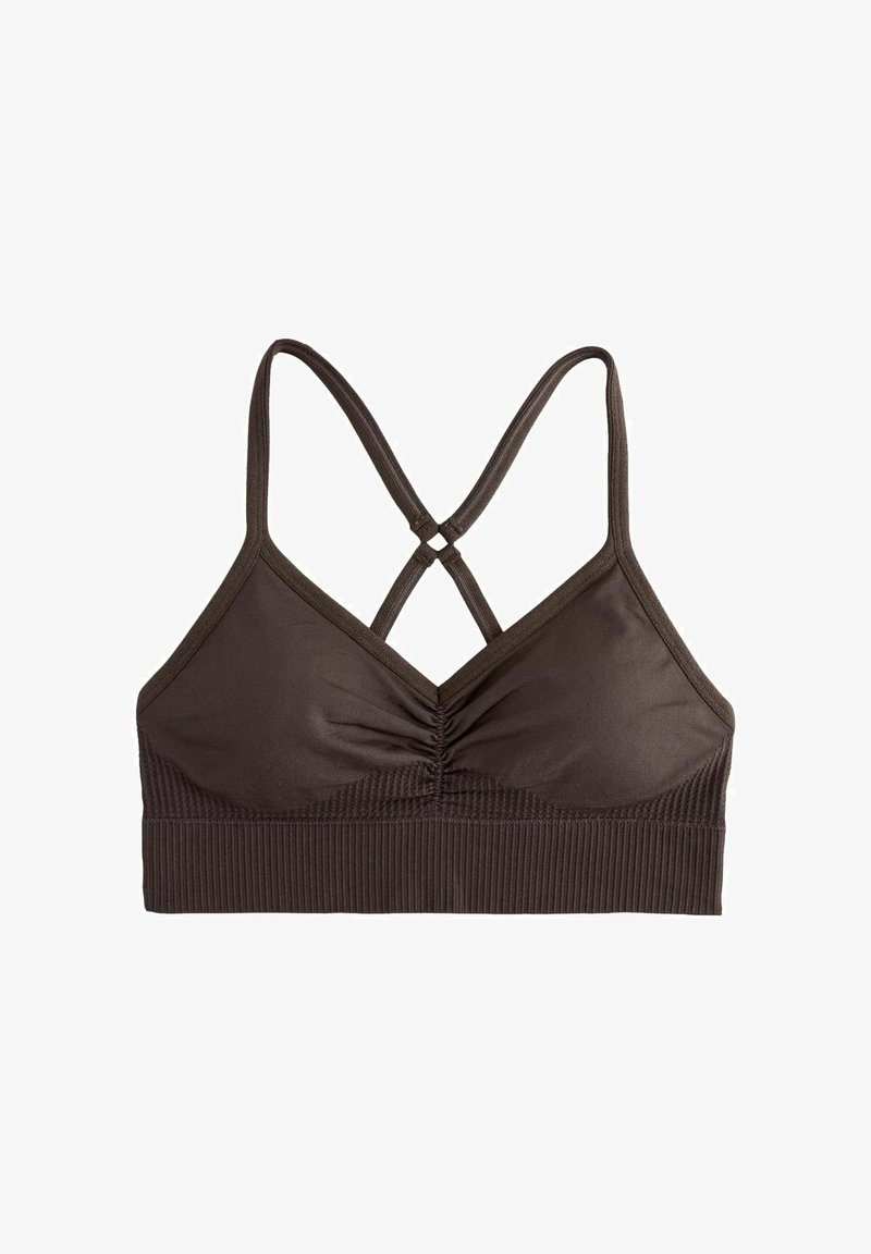 Pruun ühtlased spordirinnahoidja volditud esiosaga ja ristatud õhukeste õlapaeltega, allosas soonikkoes lai ääris.