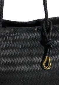Black woven leather tote bag with a braided handle. Features a gold-tone hardware accent and a textured surface with a herringbone pattern.