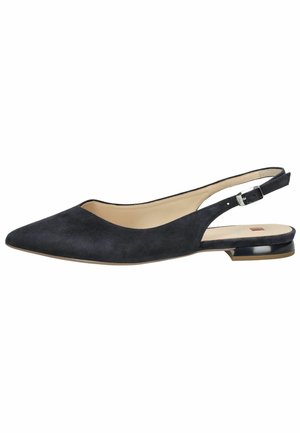 Black suede slingback flat shoe with pointed toe, low heel, and side buckle detail. Smooth inner lining and minimalistic design.