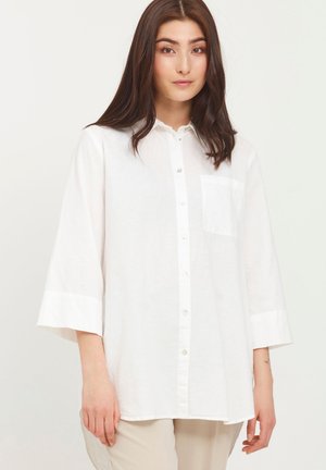 White button-up shirt made of lightweight fabric, featuring a collar, three-quarter sleeves, and a single chest pocket. Smooth texture.