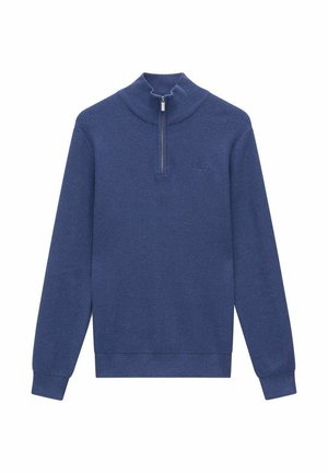 Marinblå tröja med ett strukturerat stickat mönster, hög krage och en kort dragkedja. Har långa ärmar och ribbat nederkant och ärmslut.