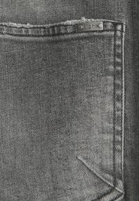 Tigha Vaqueros slim fit - grey