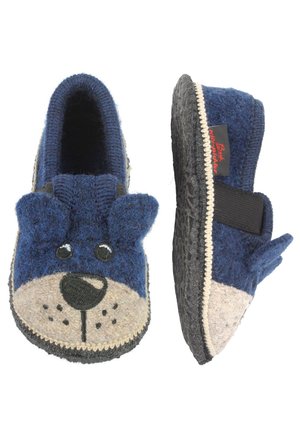 Blauwe wollen slippers met een hondengezicht ontwerp, grijs viltneus en zwarte rubberen zool. Inclusief elastische band voor een veilige pasvorm.