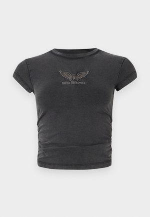 Black short-sleeve cropped t-shirt made of soft fabric, featuring an embroidered winged logo with "GUESS ORIGINALS" in an arch.