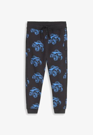 Schwarze Jogginghose für Kinder mit blauem Monstertruck-Motiv, elastischem Bund mit Kordelzug, Seitentaschen und Bündchen an den Knöcheln.