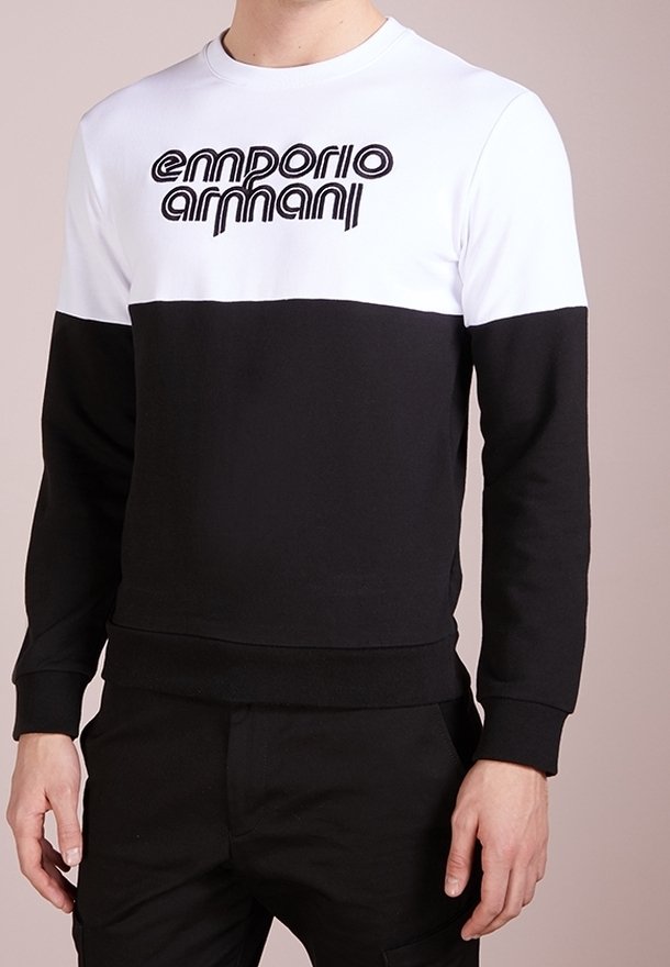 Black and white cotton sweatshirt with long sleeves and a round neckline, featuring a prominent embroidered "Emporio Armani" logo on the front.