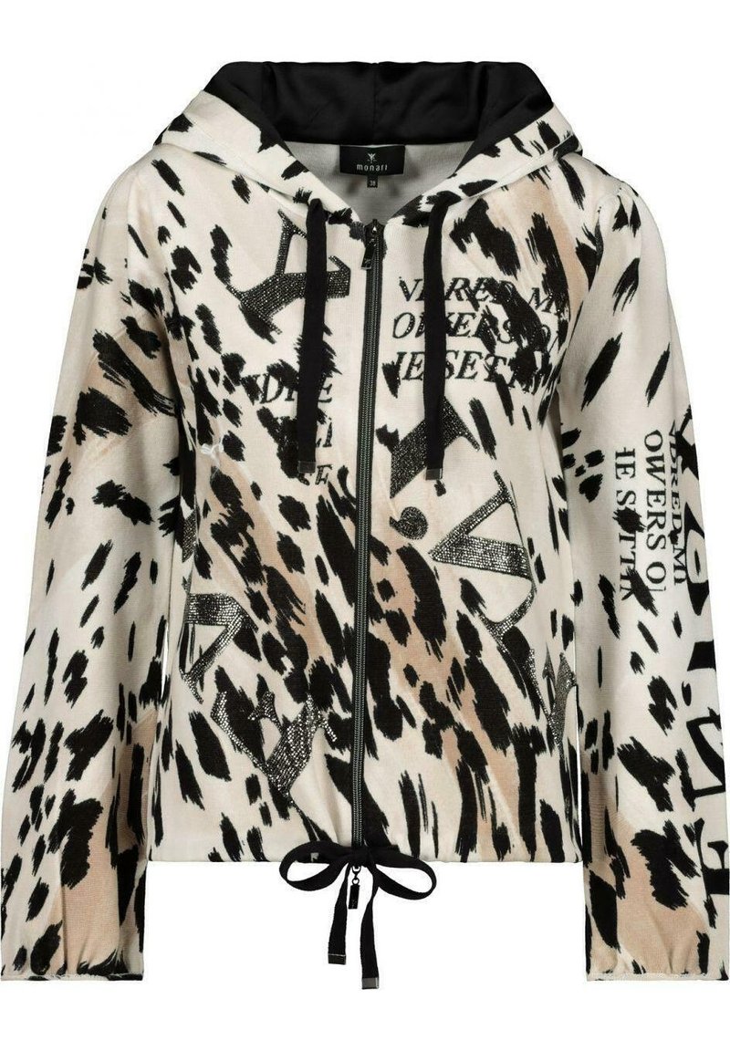 Veste à capuche zippée beige clair avec imprimé animalier noir et texte. Dotée de cordons de serrage et d'une doublure noire. Texture douce avec une coupe décontractée.