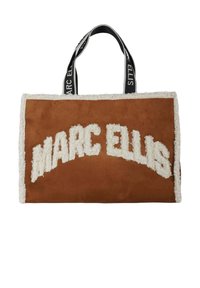 Brown suede tote bag with white faux fur trim. Features "MARC ELLIS" in plush white lettering. Black handles with brand name detail.