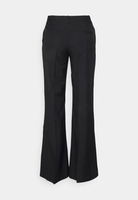 Black flared trousers with a smooth texture, featuring two back pockets and a classic waistband, designed for a fitted silhouette.