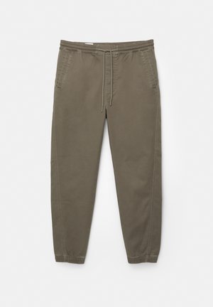 Helle olivgrüne Jogginghosen mit elastischem Bund, Kordelzug, Seitentaschen und schmal zulaufenden Bündchen. Hergestellt aus weichem, strapazierfähigem Stoff.